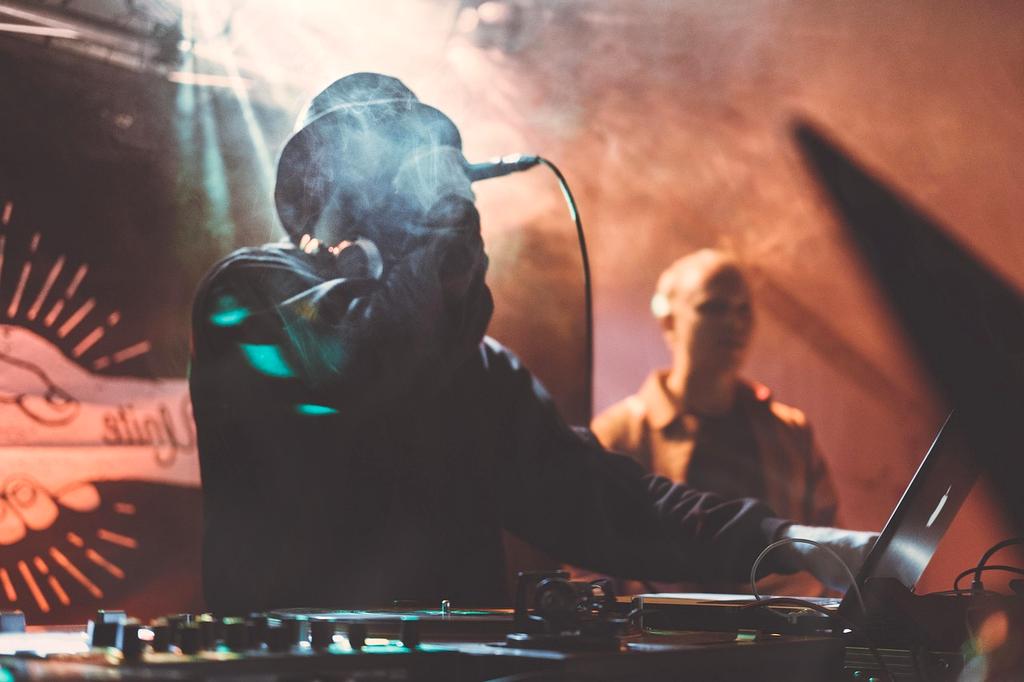 Professional entertainment stage with dramatic lighting and sound equipment